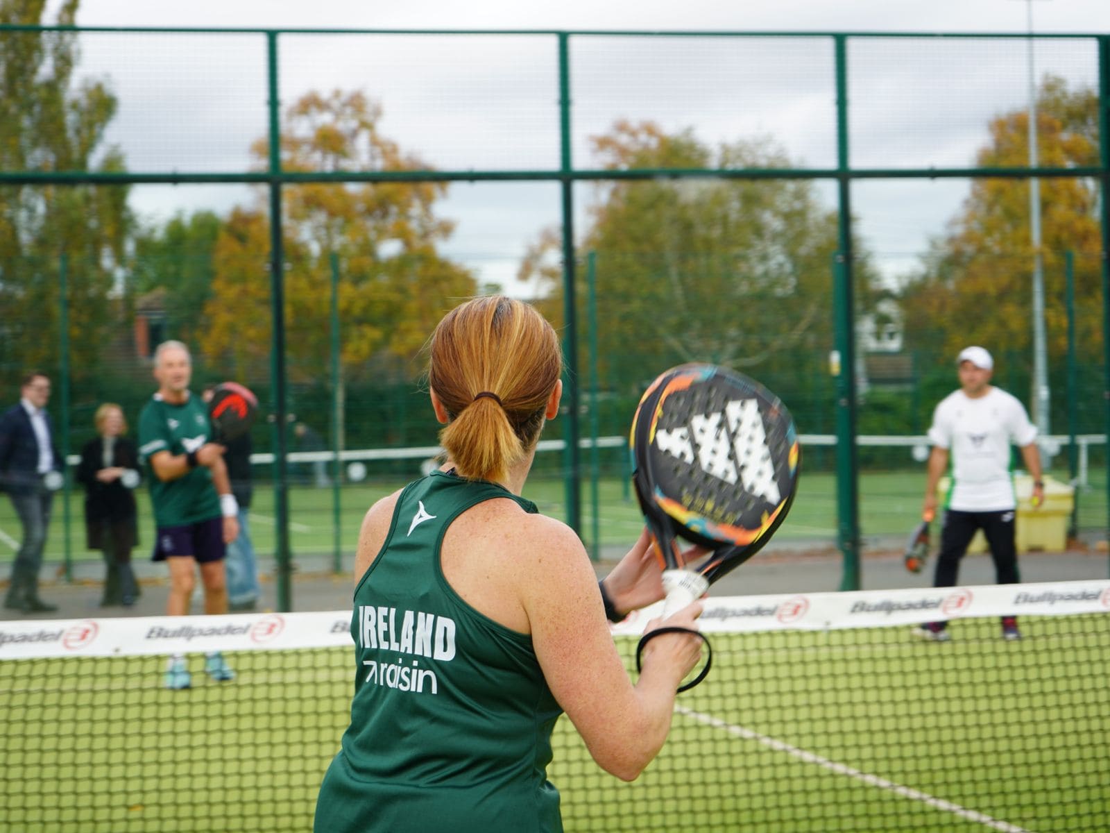 Senior padel players on court