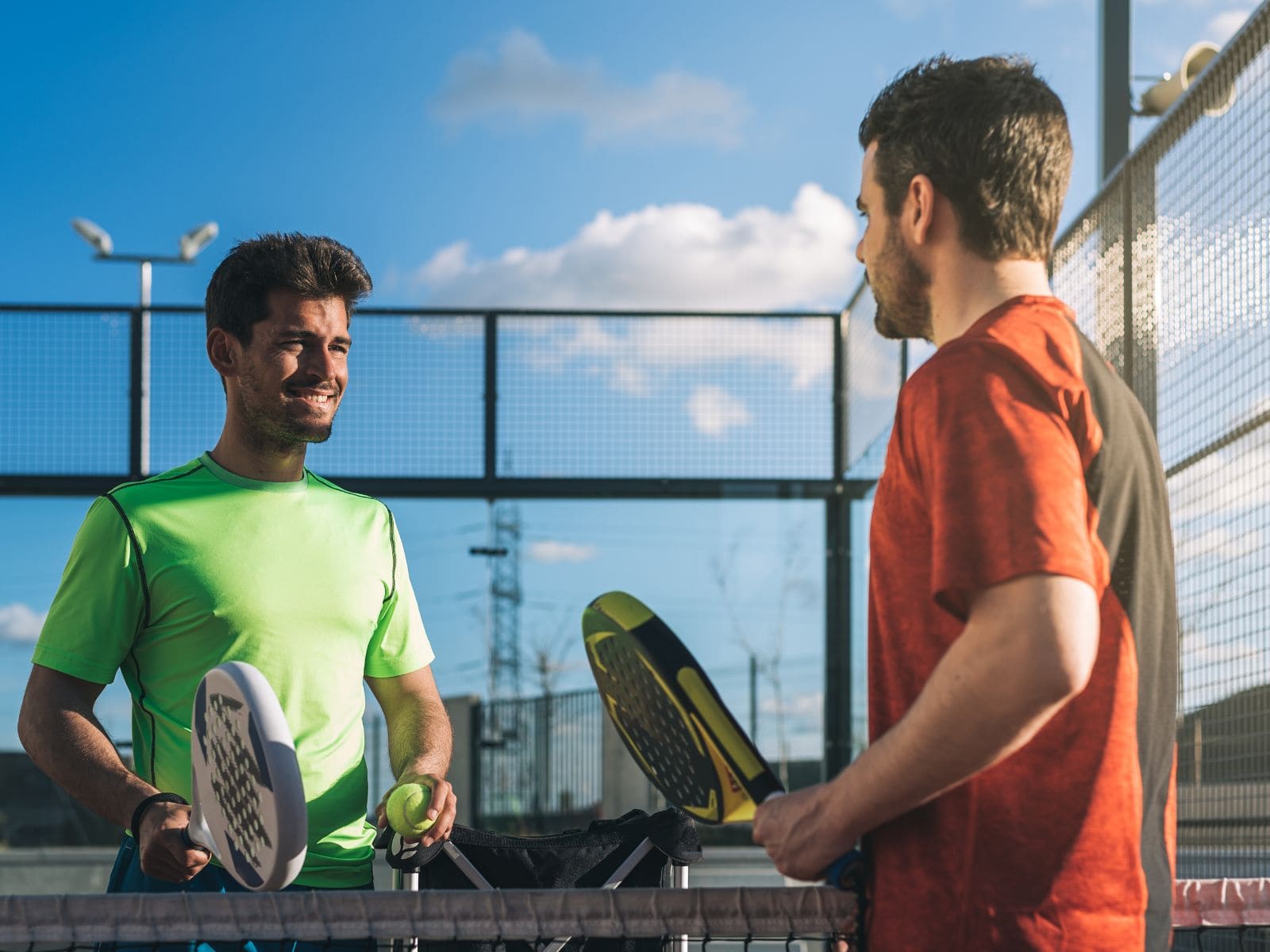 Padel players training on court