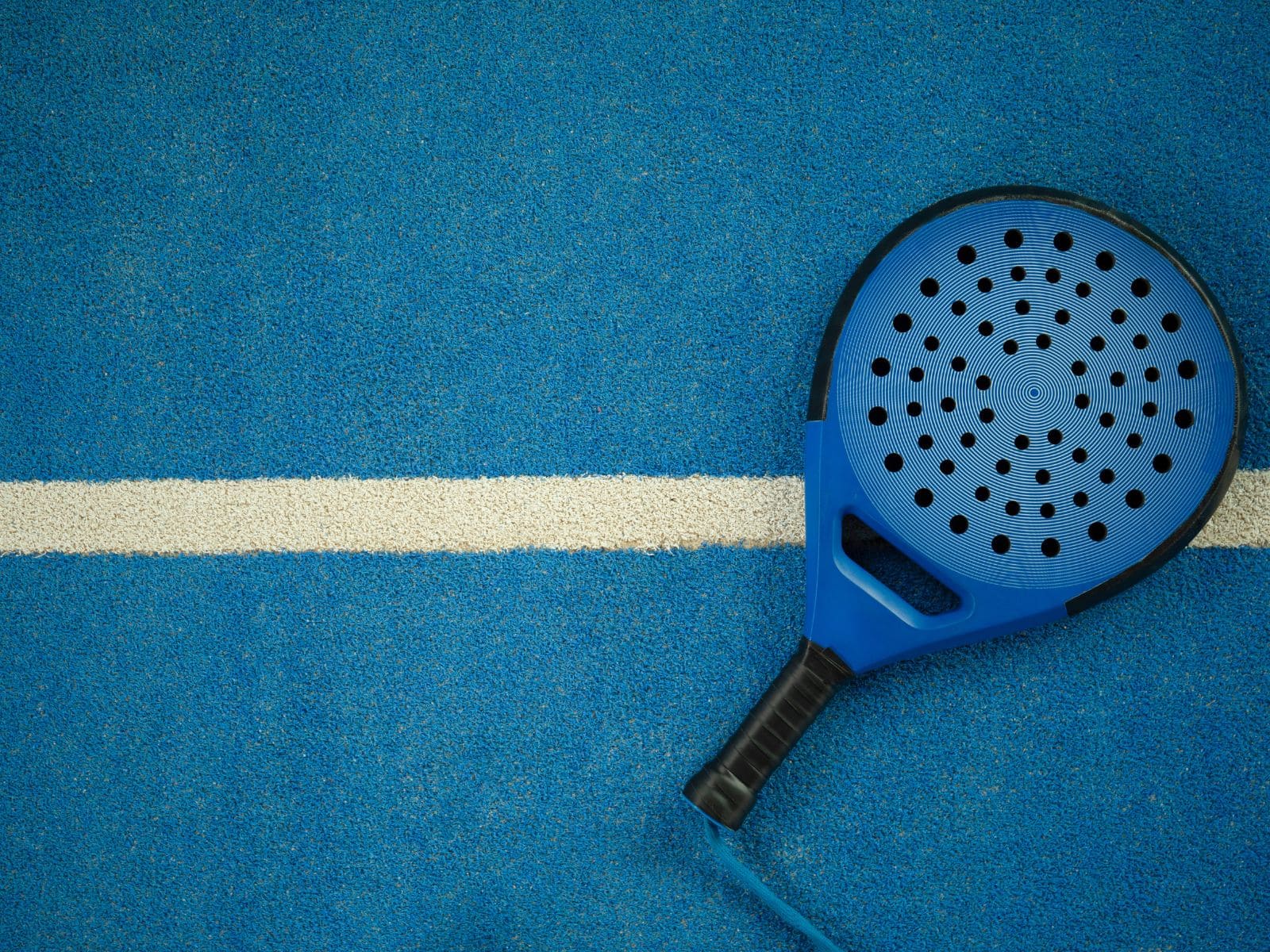 Padel players rallying on court
