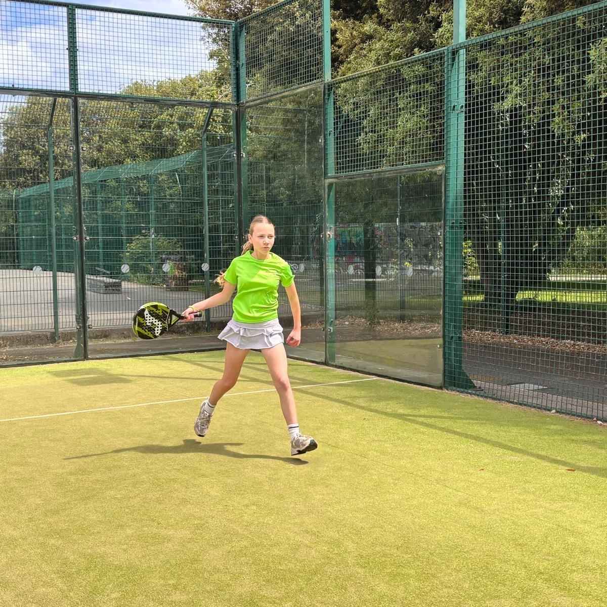Junior padel player taking part in a supervised club session